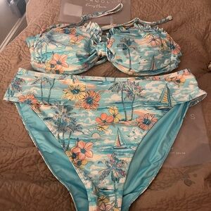 Kenny Flowers Blue Tropical Bikini with the name of The BVIS! Beautiful Suit!